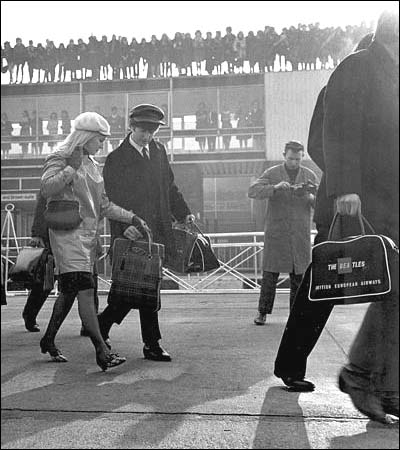 John and Cynthia Lennon at Heathrow Airport