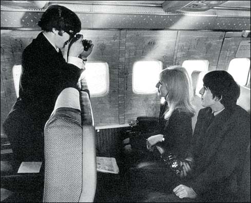 The Beatles on the plane to America